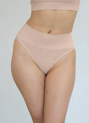 High-waisted nude G string with thick compression waistband for comfortable shaping and seamless look.
