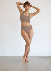 woman wearing high-waisted shape wear g string bundle with firm waistband and seamless design