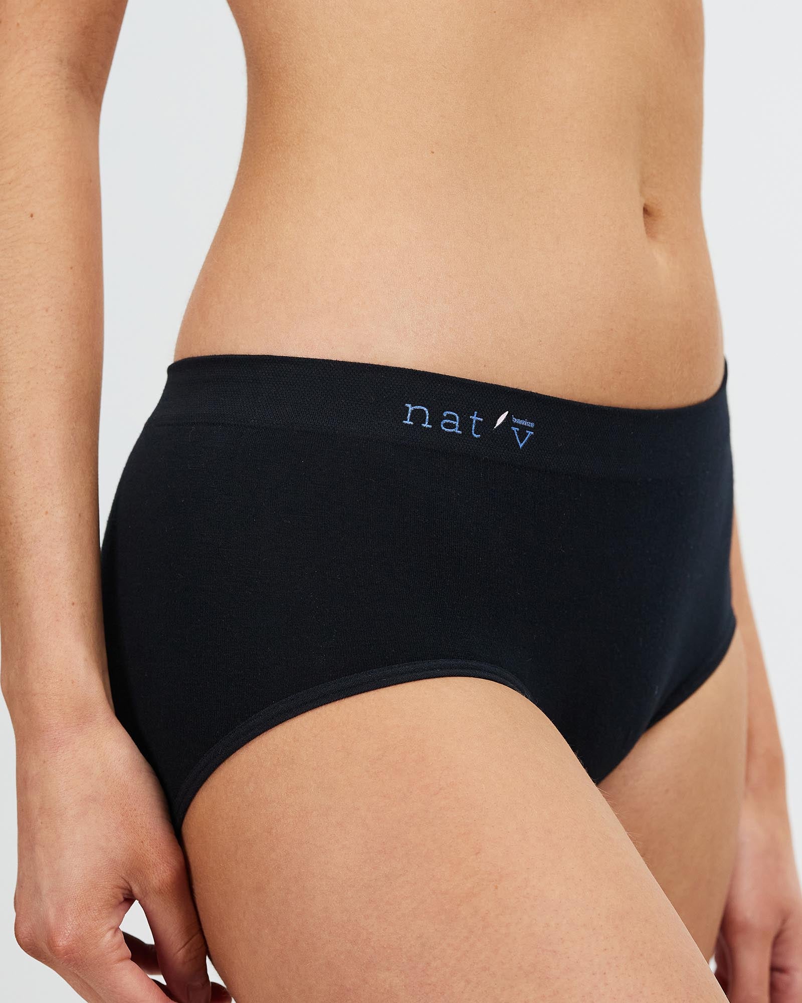 Black underwear with a brand logo on a neutral background