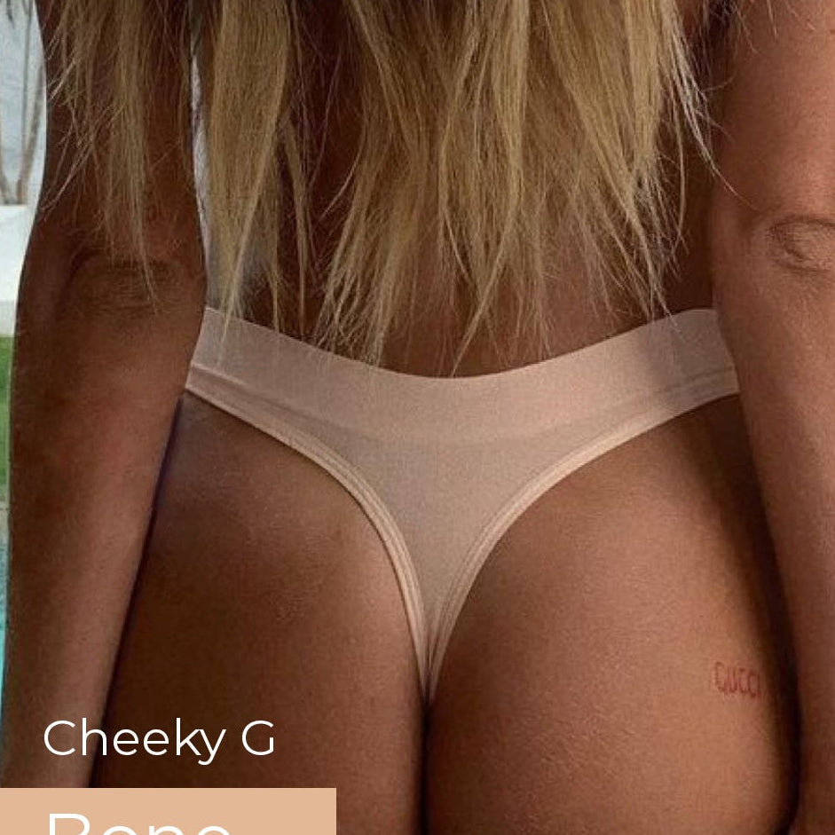 Person wearing a beige thong with 'Cheeky G Bone' text, standing by a poolside.