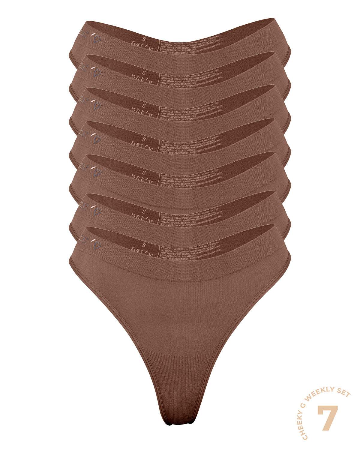 Stack of seven brown medium comfy G string underwear with thin soft waistbands and semi-seamless design in limited edition colors