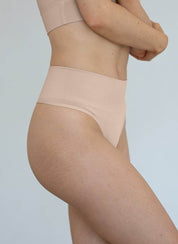 Nudes high-waisted ChiChi G-string shapewear in beige, seamless and tummy-targeting compression design.