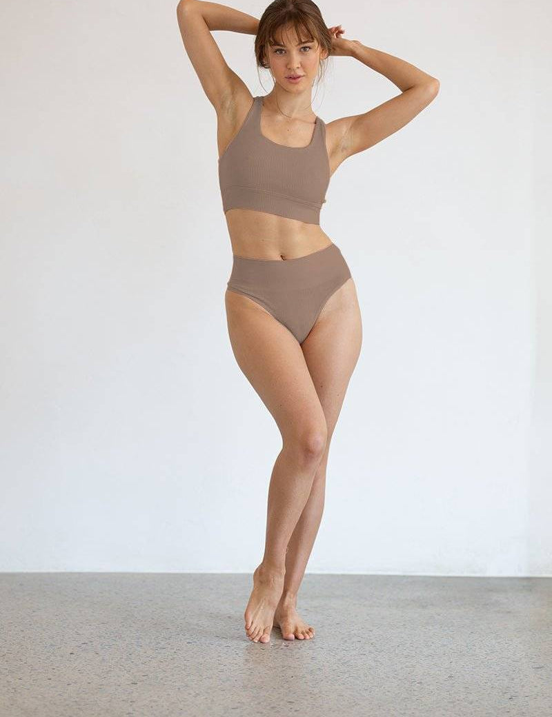 woman wearing high-waisted shape wear g string bundle with firm waistband and seamless design